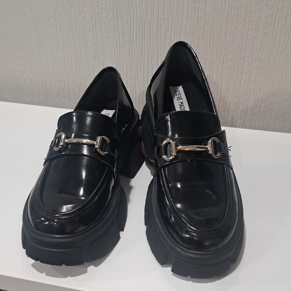 Steve Madden Patent Leather Loafer With A Silver Buckle